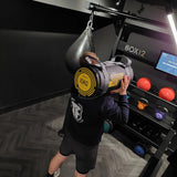  BOX12 Upclose view, with man demonstrating, screen on with Concrete wall background and loaded storage with all equipment on display