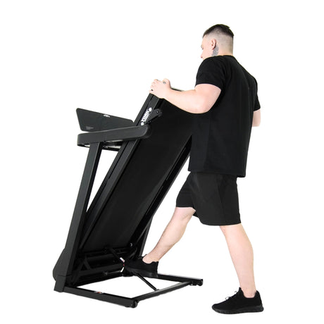 York Barbell HT5 Folding Treadmill Folding away man in action 