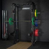 JORDAN® J75 Cable Rack Gym setting black brick background,  Barbell with Weights, Storage pegs with weights displayed, Spotter arms, Jordan olympic flooring right side and Barbell storage in background 