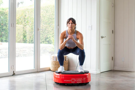 Power Plate Move Red Lady Squatting 