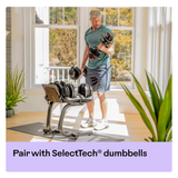 BowFlex Dumbbell Stand with Rack Man using in Home with Adjustable Dumbbells