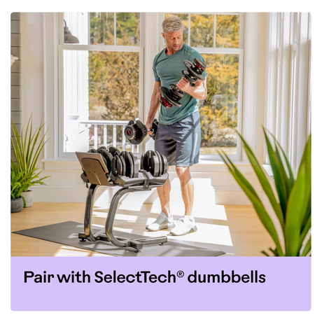 BowFlex Dumbbell Stand with Rack Man using in Home with Adjustable Dumbbells