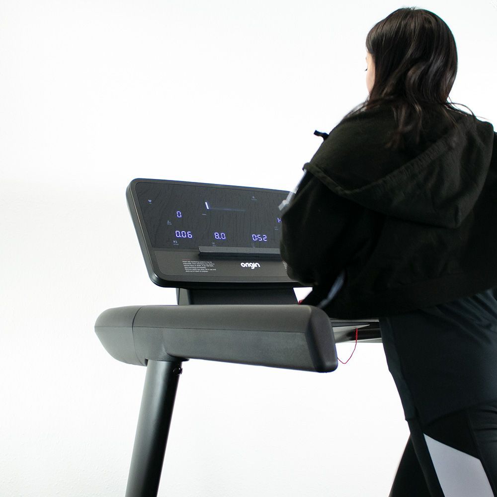 Origin Alpha Folding Treadmill In action, screen on women running