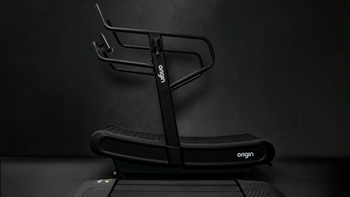 Origin Storm Curved Treadmill Side View in Gym setting