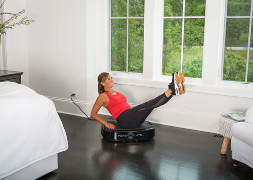 Personal Power Plate Lady using in bedroom 