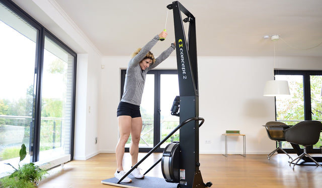 SkiErg, lady using machine indoors