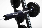 York Barbell C32HR Olympic Half Rack with Pull Up Bar, Plate & Barbell Storage close up of barbell and plates and barbell pad on rack 