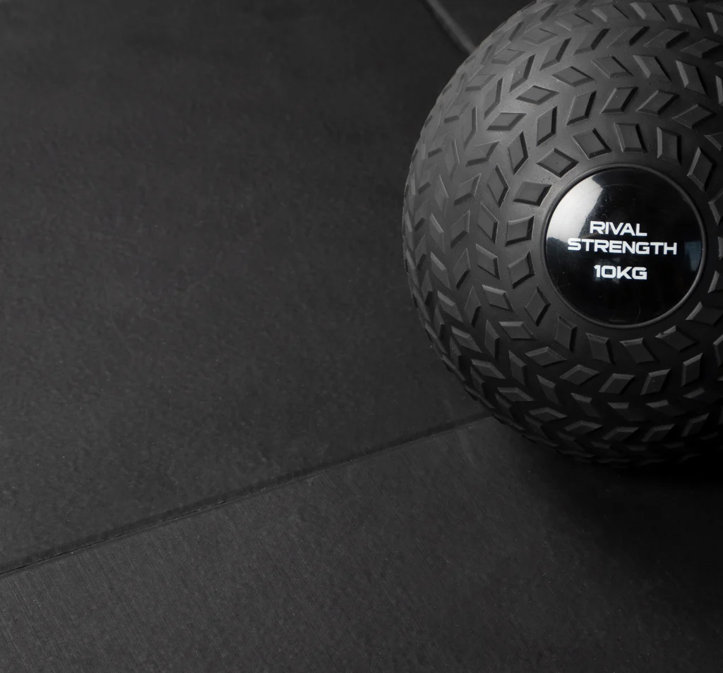 Rival Black Premium Interlocking Rubber Gym Floor Tiles Close up of Tiles flush with Slam ball 